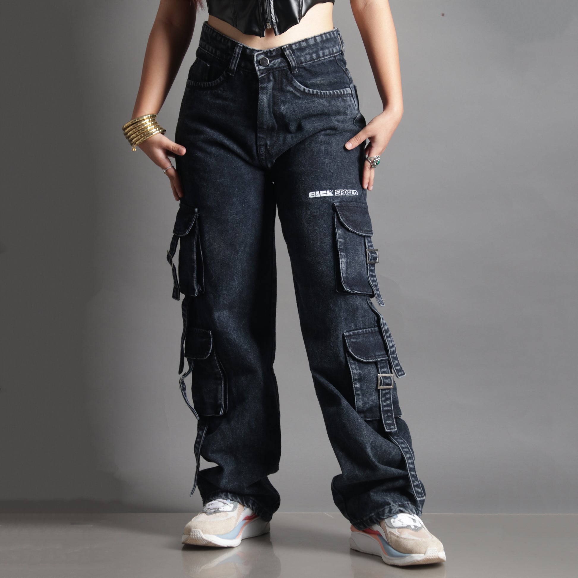 Front view of model wearing the Midneight Cargo Pants (Women's), with upper body cropped out to highlight the pants’ fit, design, and pocket placement.
