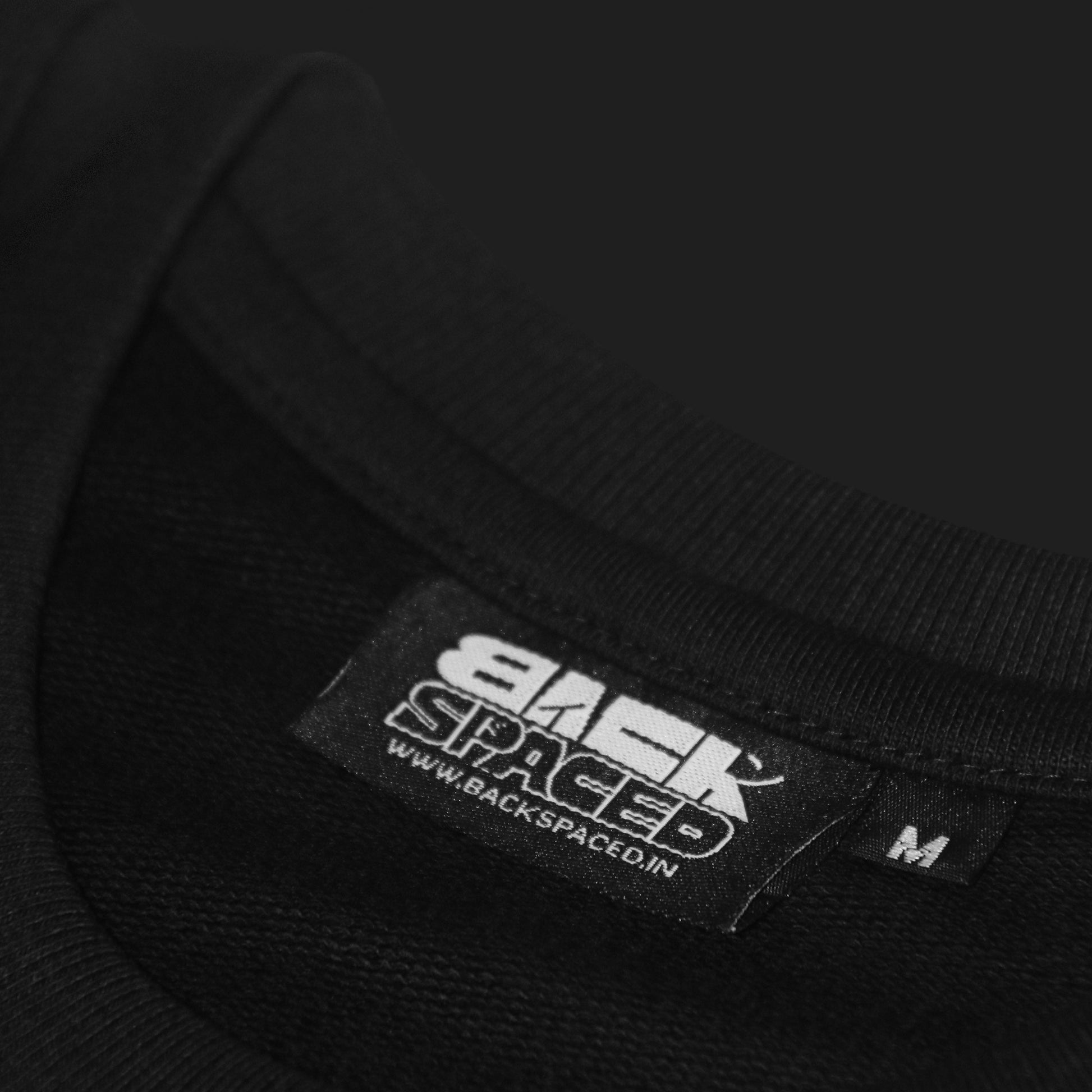 closeup tag of 'ākēdo' by backspaced, Premium oversized streetwear t-shirt